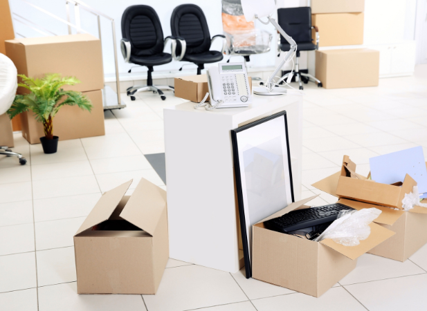 Office packing services being displayed with boxes and other office materials being packed