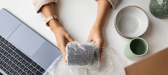 image of woman holding fragile tech equipment