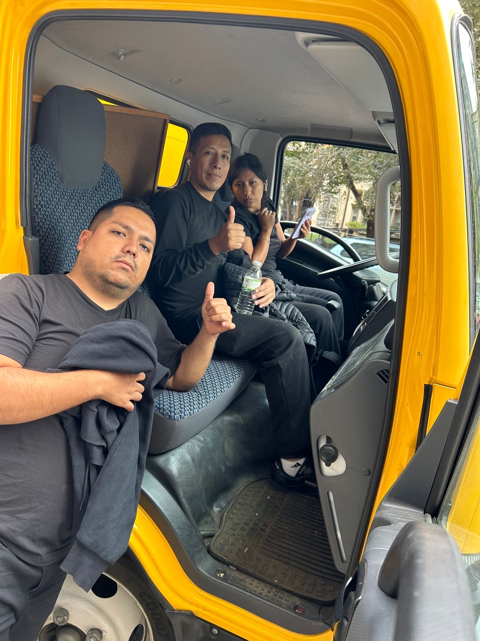 An expert movers on a truck having thumbs up