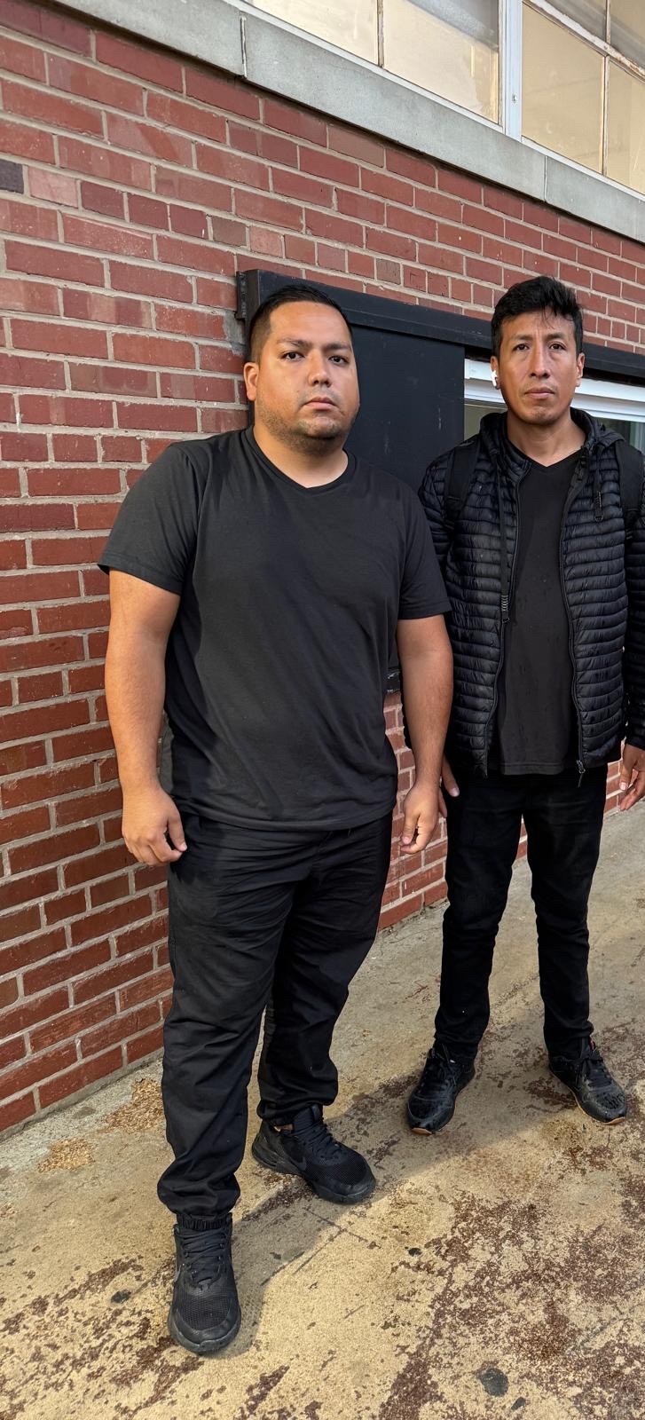 Military movers by E-Logic moving company standing outside the building