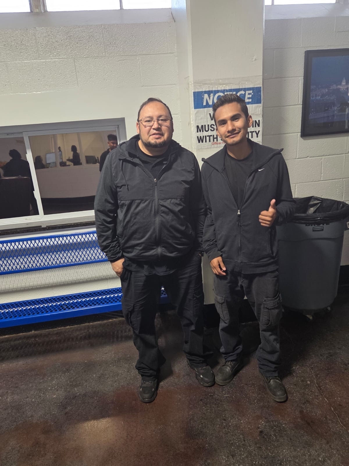 Residential movers from E-Logic moving wearing black jackets